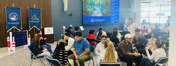 SFBU students painting together during Digital Detox Day in the Learning Resource Center