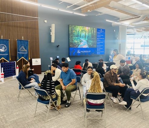 SFBU students painting together during Digital Detox Day in the Learning Resource Center