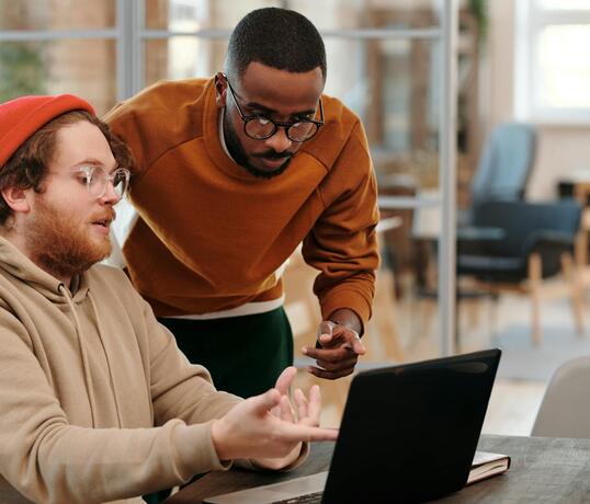 Diverse colleagues brainstorming together in a modern office, fostering teamwork and creativity.