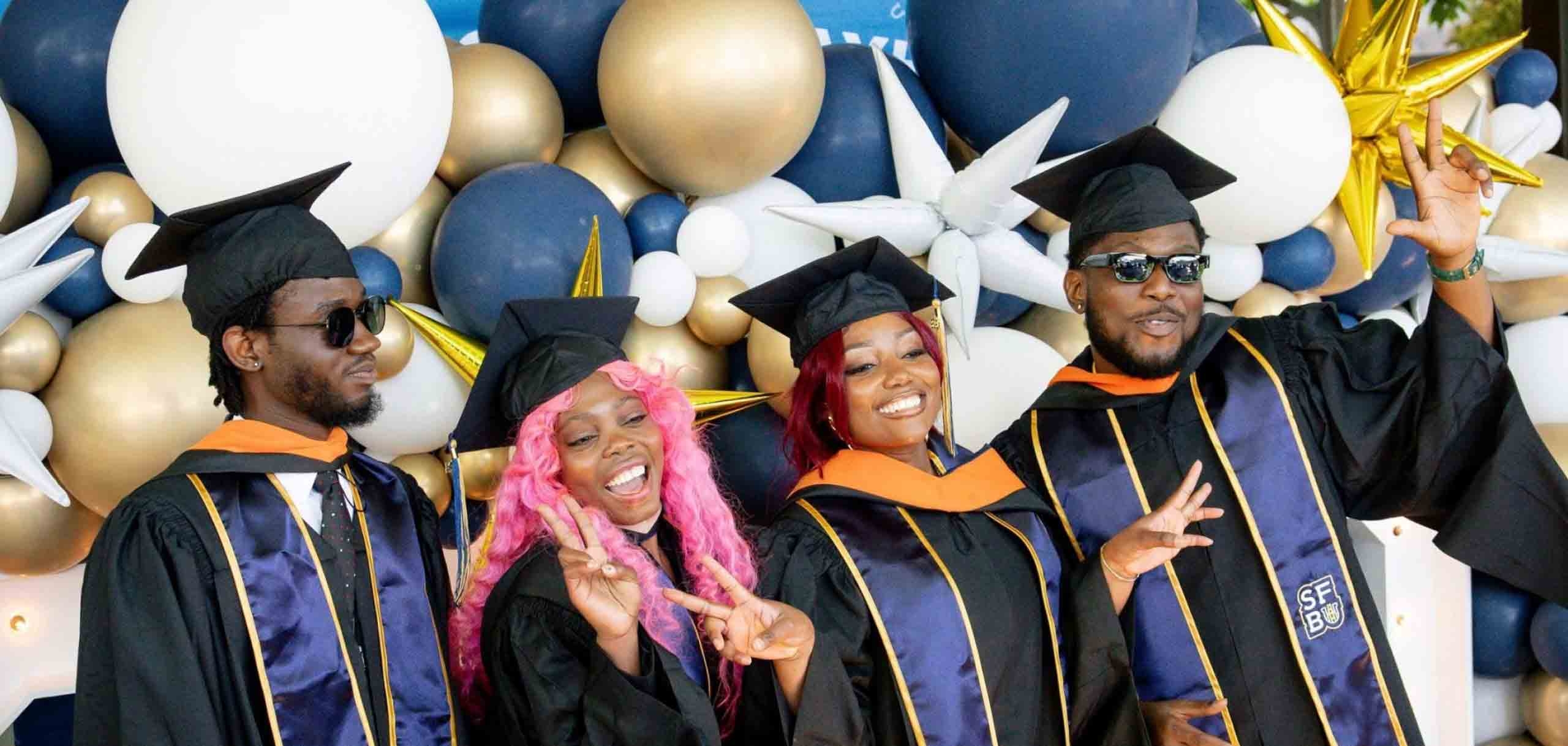 Happy students graduating in the cap and gowns