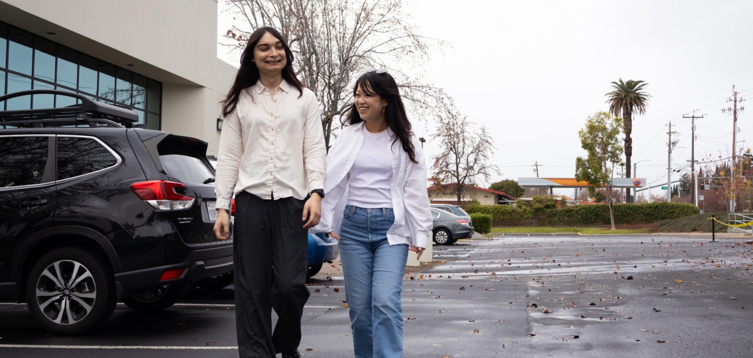 Two specialists, Leslie and Evelyn are walking around the campus