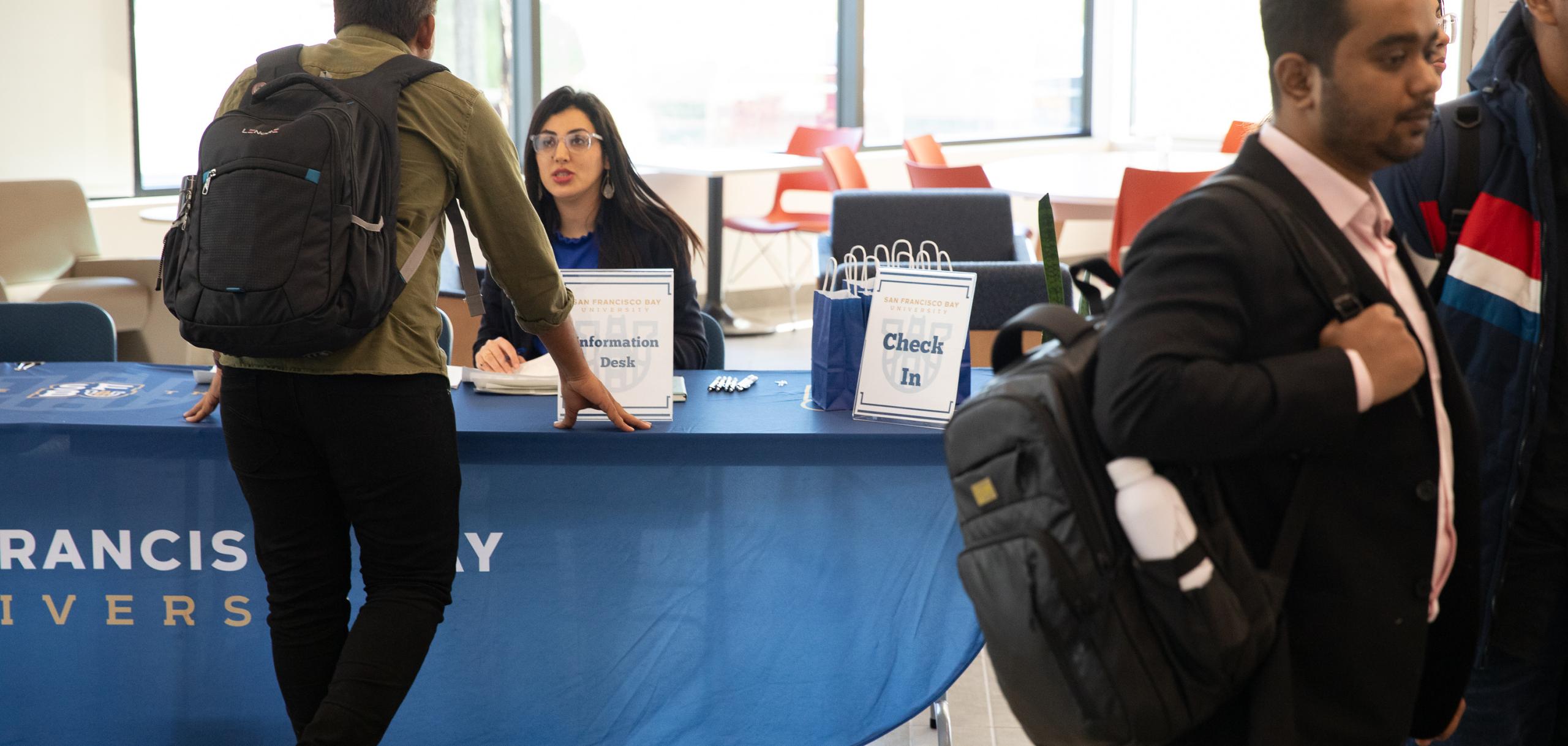 Enrollment management officer is helping a new student during the new student orientation day