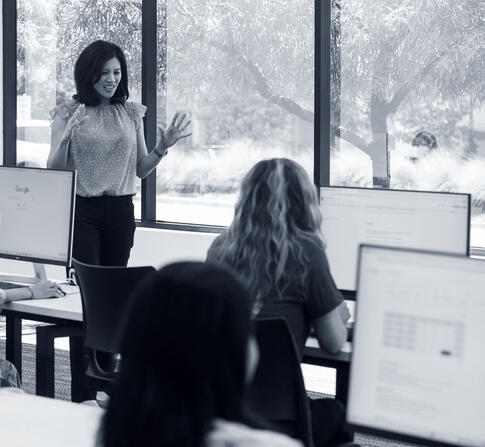 Teacher in front of computer lab class