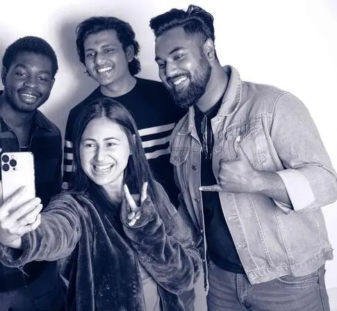 Group of students taking selfie with iphone