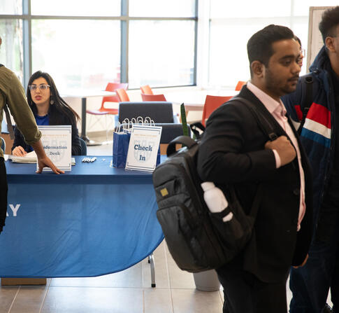 Enrollment management officer is helping a new student during the new student orientation day