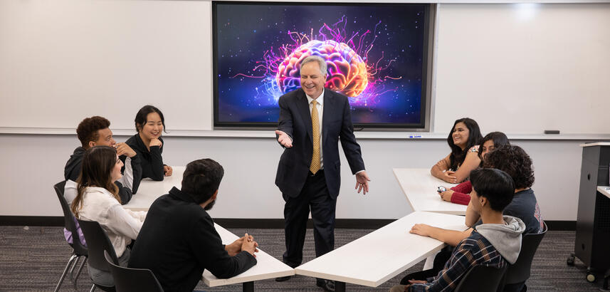 President in front of classroom