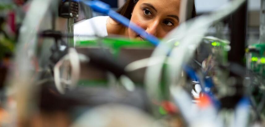 Photo Of Female Engineer Looking Through Wires